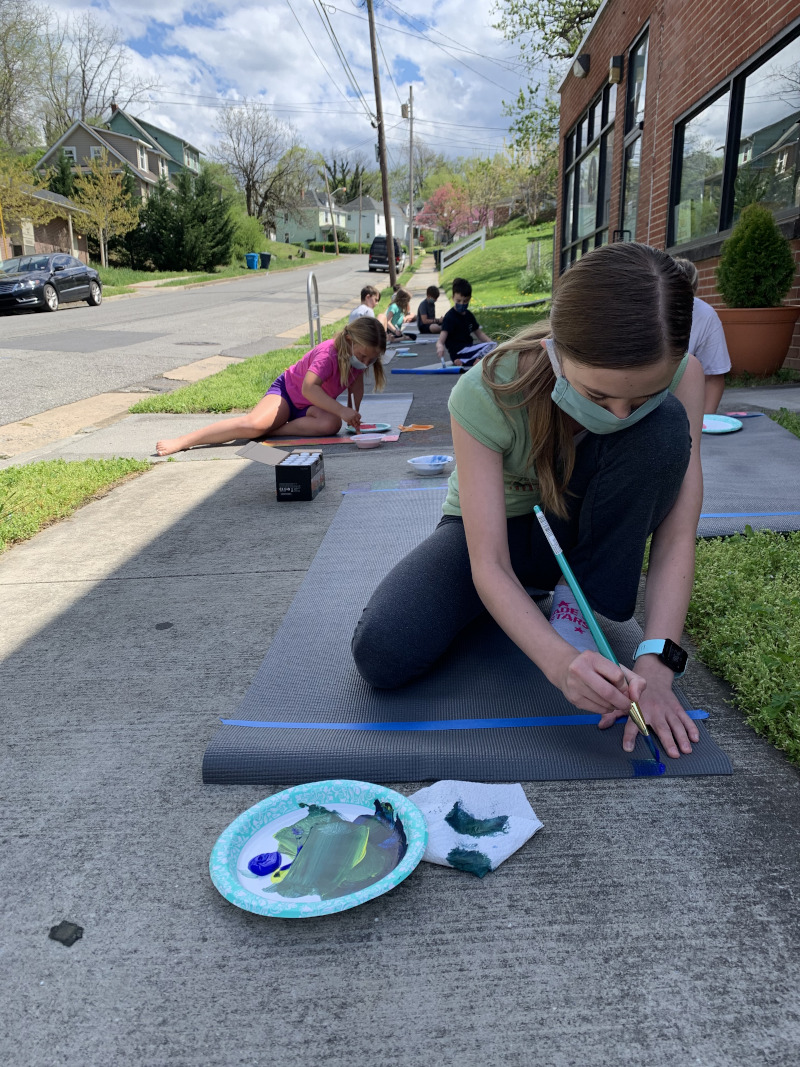 Kids painting yoga mats