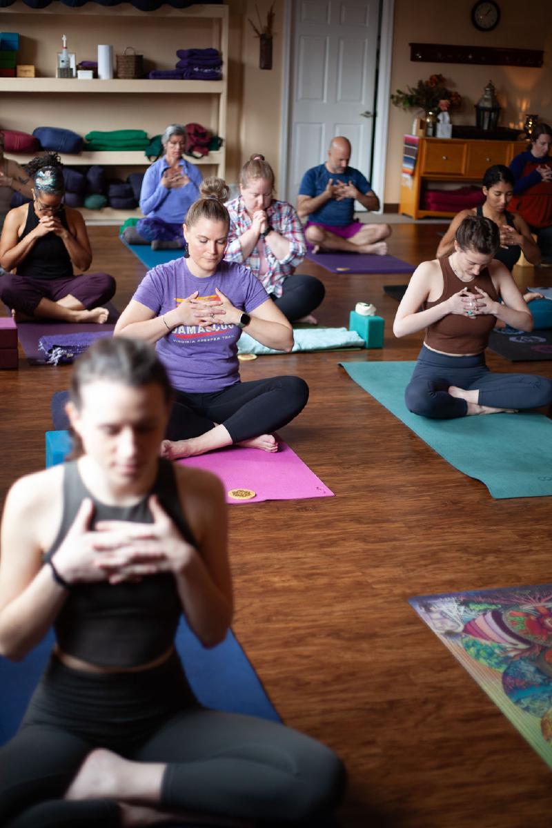 woman balancing on yoga mat