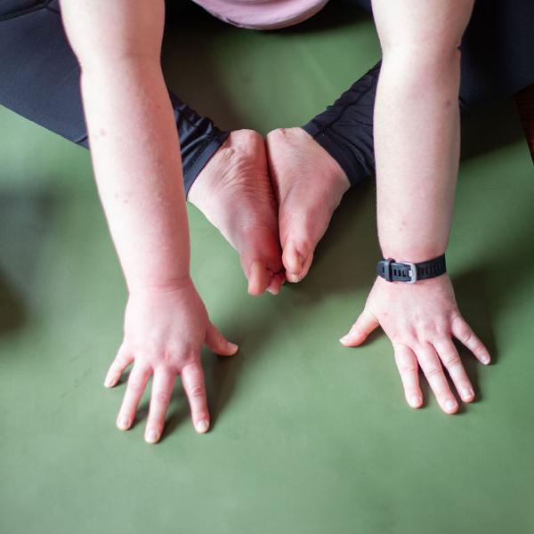 students doing three-legged dog pose