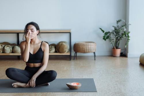 woman seated on yoga mat