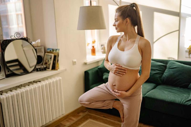 pregant woman in standing yoga pose