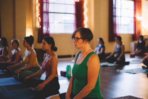 yoga students in quiet reflection